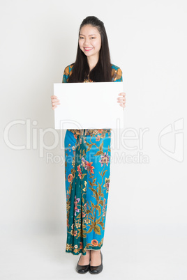 Asian girl holding white card