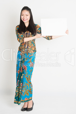 Asian girl showing placard
