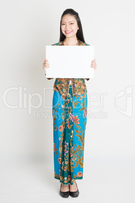 Asian girl holding a poster