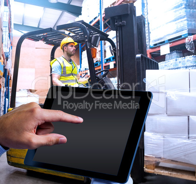 Composite image of man using tablet pc