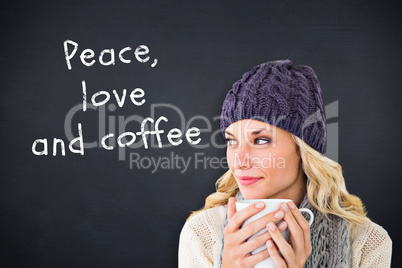 Composite image of pretty blonde in winter fashion holding mug