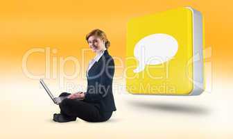 Composite image of redhead businesswoman using her laptop