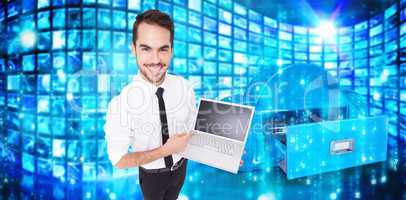 Composite image of smiling businessman pointing his laptop