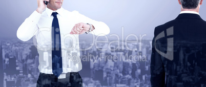 Composite image of rear view of an elegant businessman