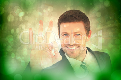 Composite image of businessman smiling and making ok sign