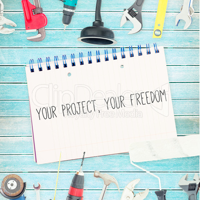 Your project, your freedom against tools and notepad on wooden b