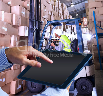 Composite image of man using tablet pc