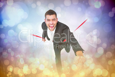 Composite image of businessman crossing the finish line
