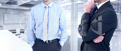 Composite image of frowning businessman thinking