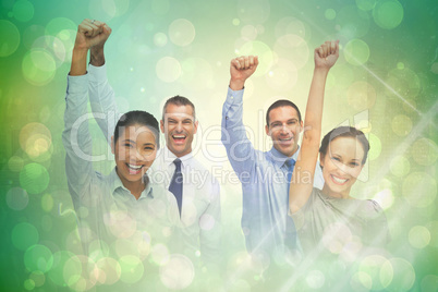 Composite image of cheerful work team posing with hands up