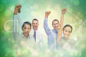 Composite image of cheerful work team posing with hands up