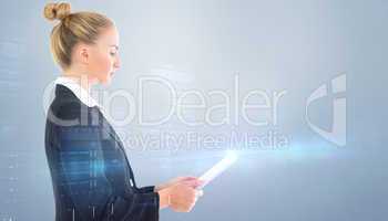 Composite image of businesswoman holding tablet