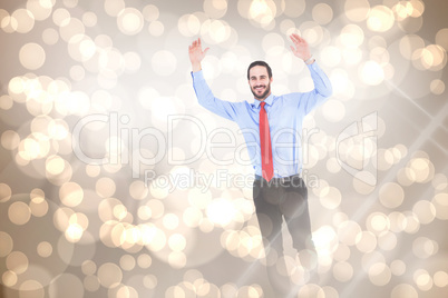 Composite image of smiling businessman stepping with hands raise