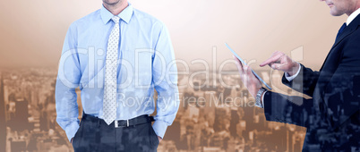 Composite image of businessman looking at the camera