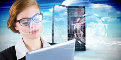 Composite image of redhead businesswoman using her tablet pc