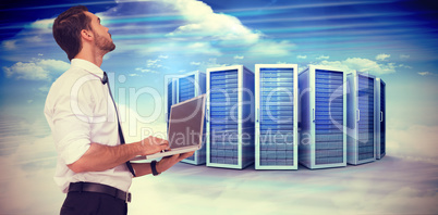 Composite image of sophisticated businessman standing using a la