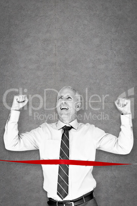 Composite image of businessman winning race