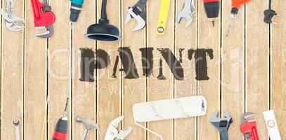 Paint against diy tools on wooden background