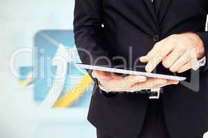 Composite image of mid section of a businessman touching digital