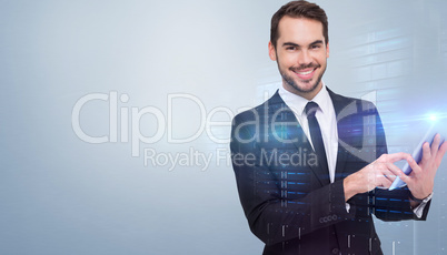 Composite image of businessman using his tablet while looking at