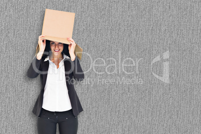 Composite image of anonymous businesswoman holding a megaphone