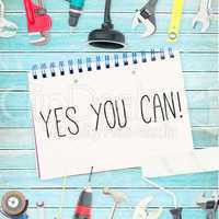 Yes you can! against tools and notepad on wooden background
