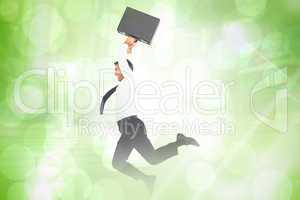 Composite image of smiling businessman leaping while briefcase