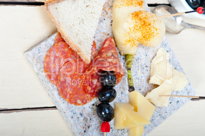 mix cold cut on a stone with fresh pears