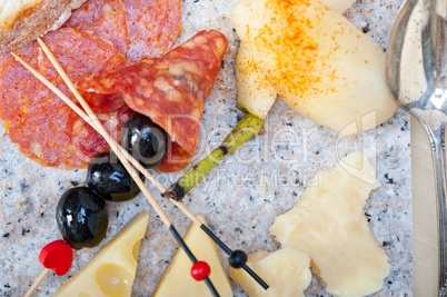 mix cold cut on a stone with fresh pears