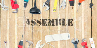 Assemble against diy tools on wooden background