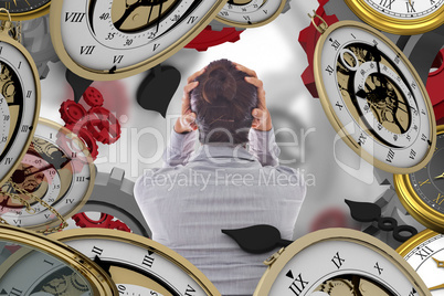 Composite image of businesswoman with hands on head