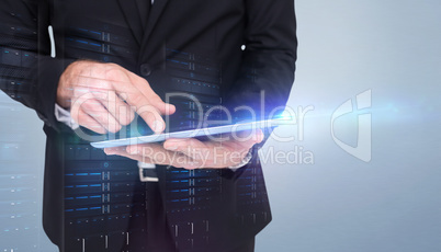 Composite image of mid section of a businessman touching digital