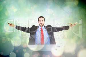 Composite image of unsmiling businessman sitting with arms outst