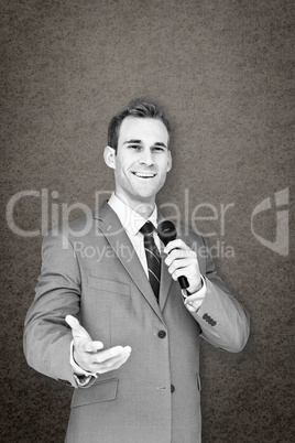 Composite image of businessman giving speech