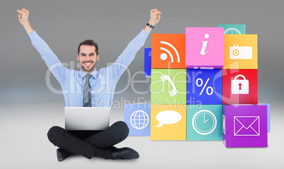 Composite image of smiling businessman sitting on the floor chee