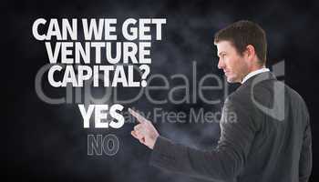 Composite image of serious businessman standing and pointing the