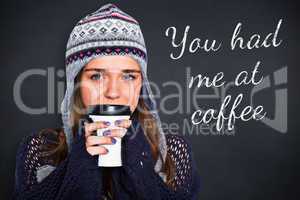 Composite image of beautiful woman in warm clothing drinking cof