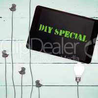 Diy special against bulbs and tablet on wooden background