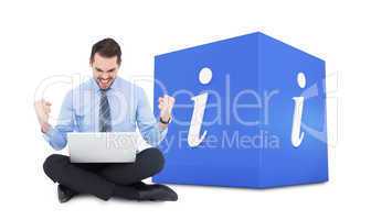 Composite image of businessman sitting with his laptop cheering