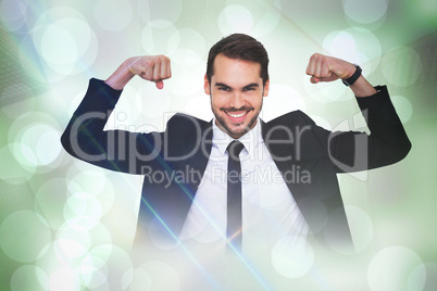 Composite image of happy businessman in suit cheering