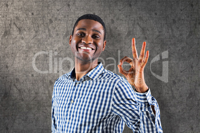 Composite image of happy businessman making ok sign