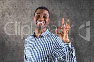 Composite image of happy businessman making ok sign