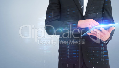 Composite image of businessman touching his tablet pc