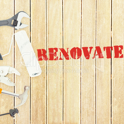 Renovate  against tools on wooden background