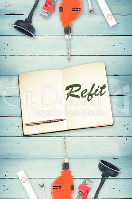 Refit against tools and notepad on wooden background