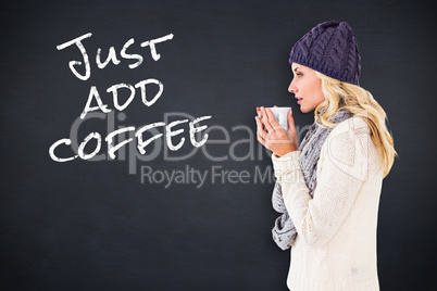 Composite image of pretty blonde in winter fashion holding mug