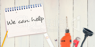 We can help against tools and notepad on wooden background