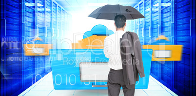 Composite image of businessman standing back to camera holding u