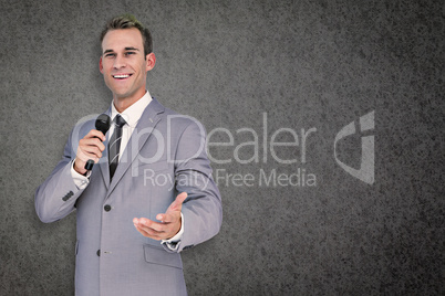 Composite image of businessman giving speech