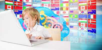Composite image of cute boy using laptop